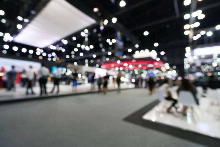 Blurred crowd at a convention hall.